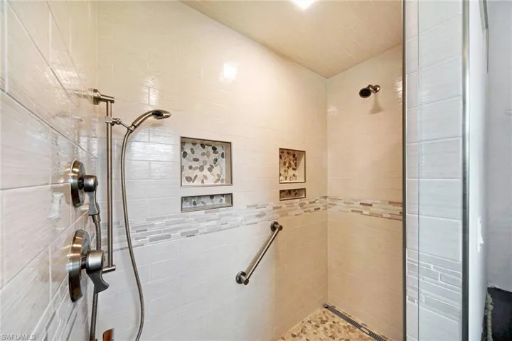 Bathroom featuring a tile shower