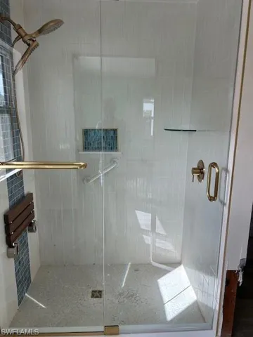 Bathroom featuring a shower with shower door