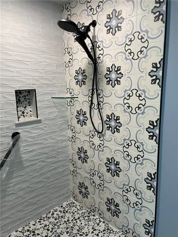 Bathroom featuring tiled shower
