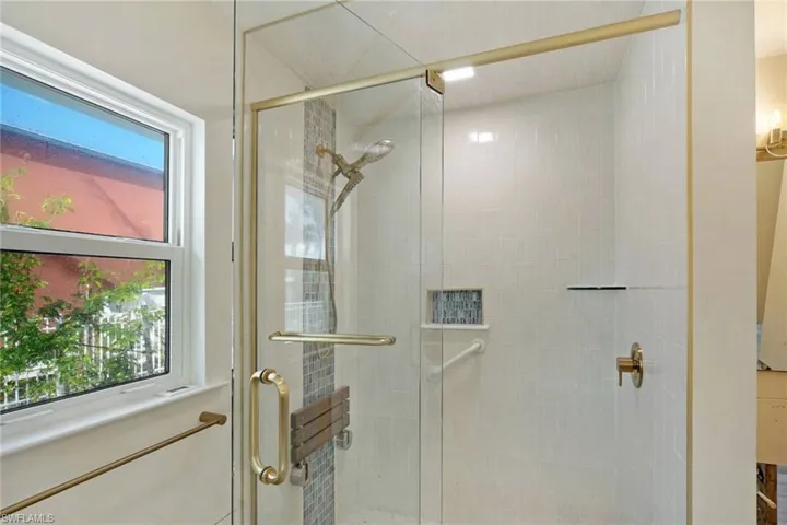Bathroom with a shower with door