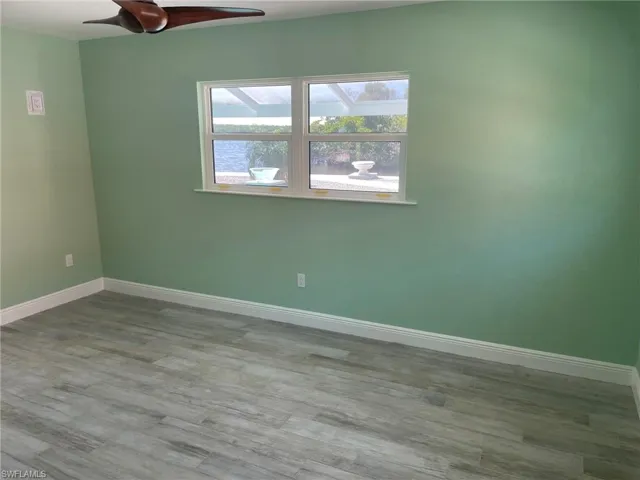 Spare room featuring light hardwood / wood-style floors and ceiling fan