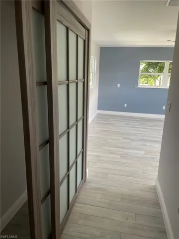 Hallway featuring light hardwood / wood-style flooring