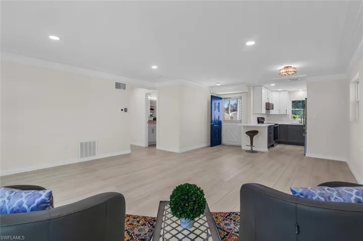 Living room with ornamental molding, wafer lights