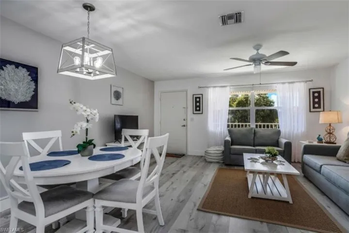 Pre Ian Dining area featuring wood finished floors and a ceiling fan