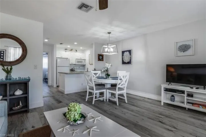 Pre Ian Dining room featuring ceiling fan, dark wood-style flooring, and recessed lighting
