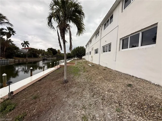 View of yard with a water view