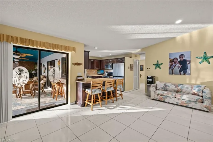 Tiled living room with a textured ceiling
