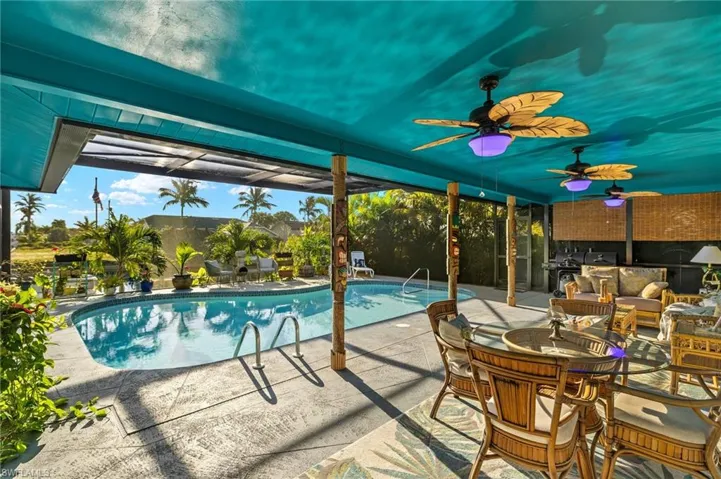 Pool with a patio and ceiling fan
