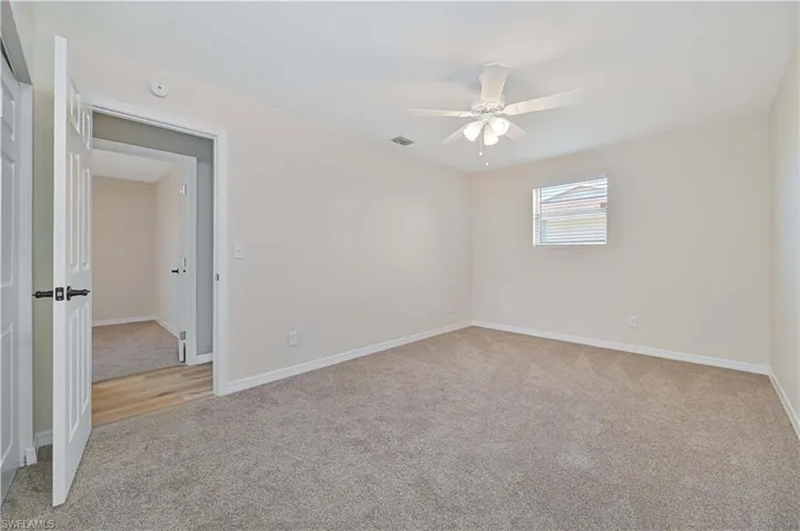 Neutral-toned carpeting throughout
