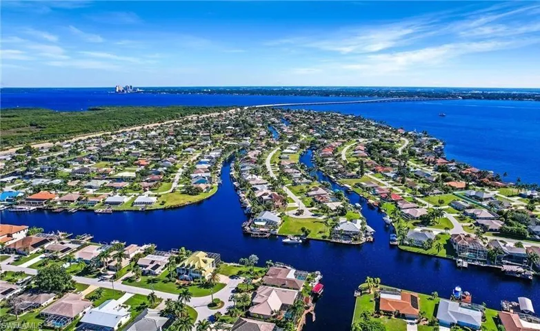 Aerial perspective of suburban area with a large body of water