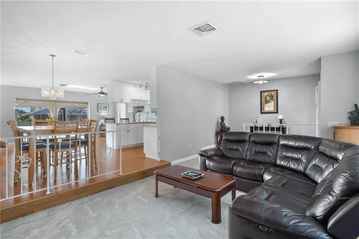 Living area with a chandelier and a ceiling fan