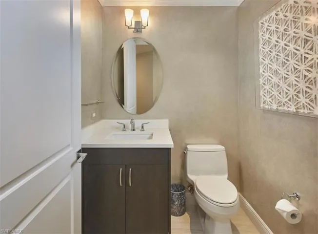 Bathroom featuring vanity and ornamental molding
