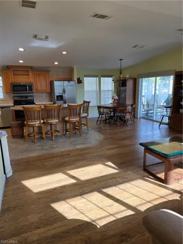 Living area featuring recessed lighting and light wood finished floors