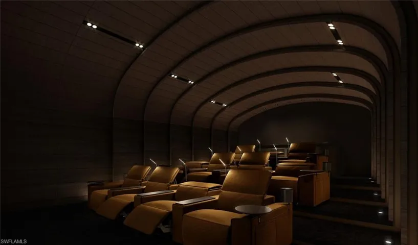 Theater featuring lofted ceilings