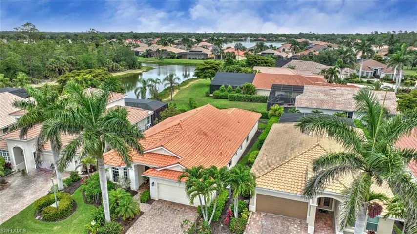 Aerial perspective of suburban area featuring a large body of water