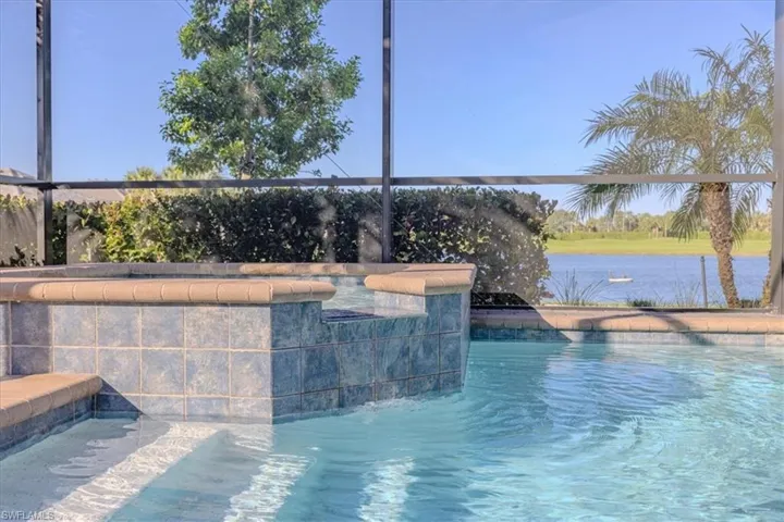 View of swimming pool with pool water feature