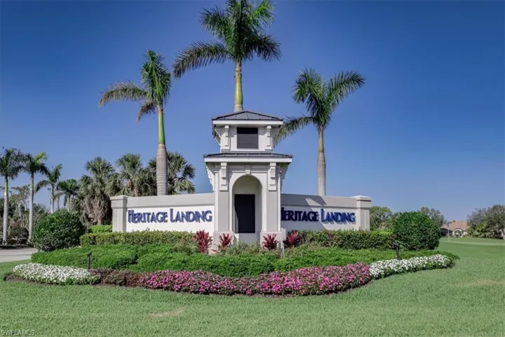 Community / neighborhood sign with a lawn