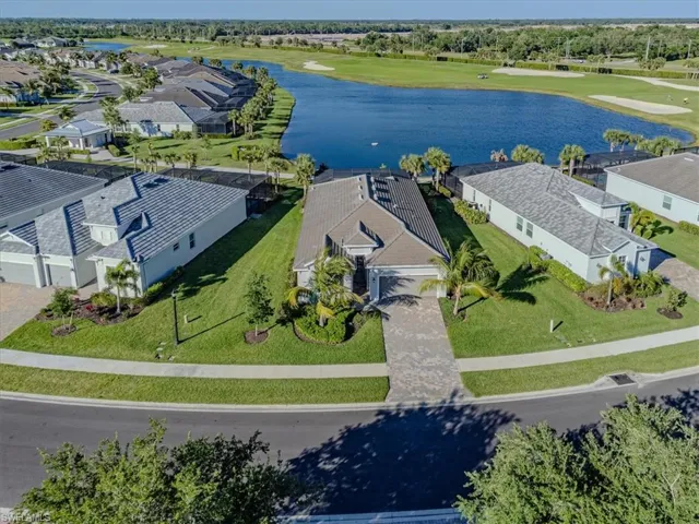 Bird's eye view with a water and golf course view.