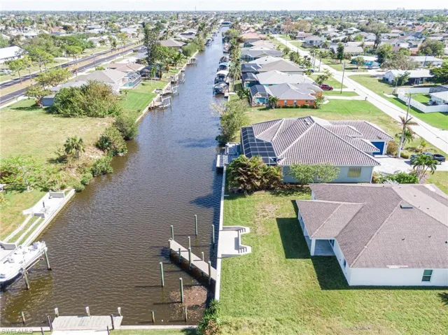 Aerial perspective of suburban area with a large body of water
