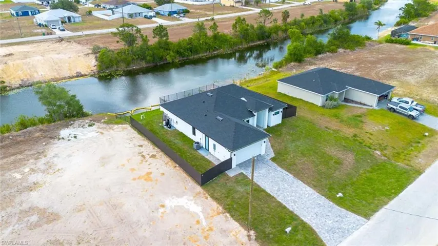 Bird's eye view featuring a water view and a residential view