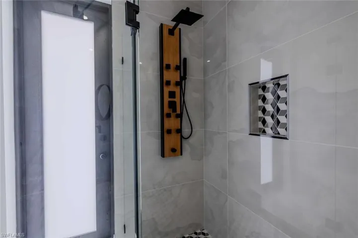 Room details with a shower stall