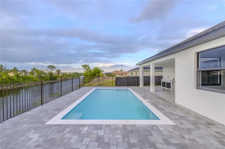 View of pool with a patio, a fenced in pool, and a fenced backyard