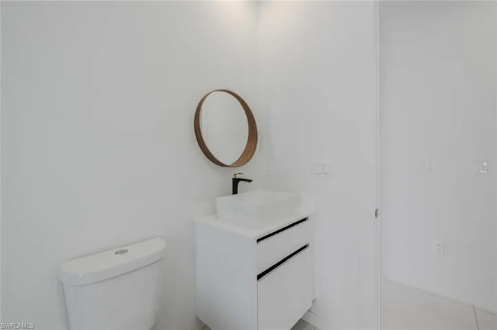 Bathroom with toilet and vanity