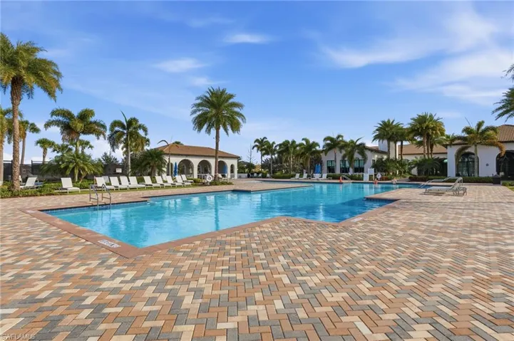 Community pool featuring a patio