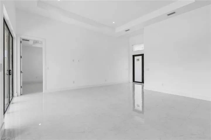 Empty room with a raised ceiling