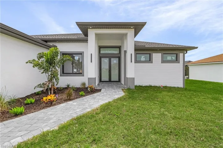 Property entrance featuring a yard