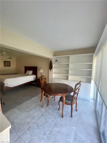 Bedroom featuring light tile flooring