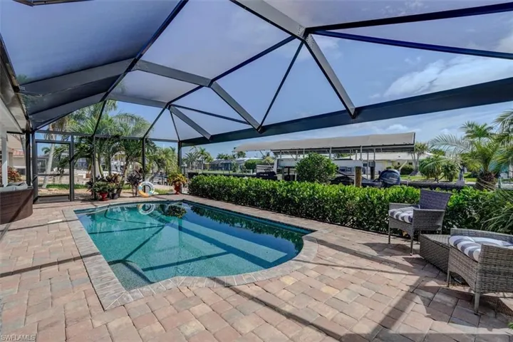 Pool with privacy landscape along pool cage