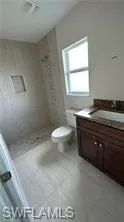 Bathroom featuring vanity and a stall shower