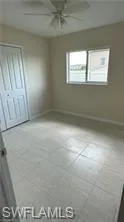 Unfurnished bedroom featuring a closet and ceiling fan
