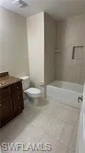 Full bathroom with vanity and  shower combination