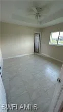 Unfurnished room featuring baseboards