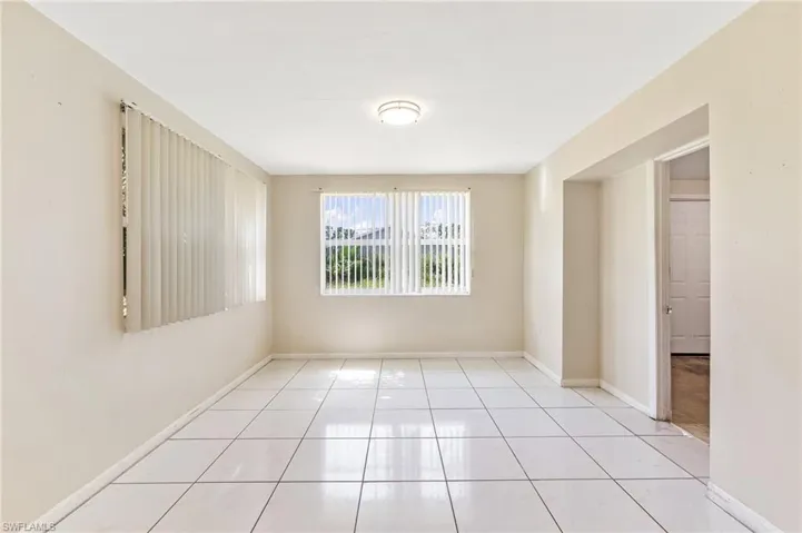 Tiled spare room with baseboards