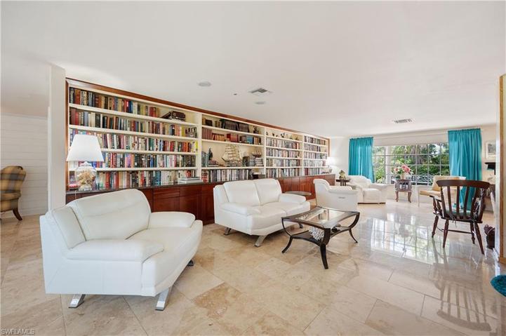 Living room with custom built in bookshelf.