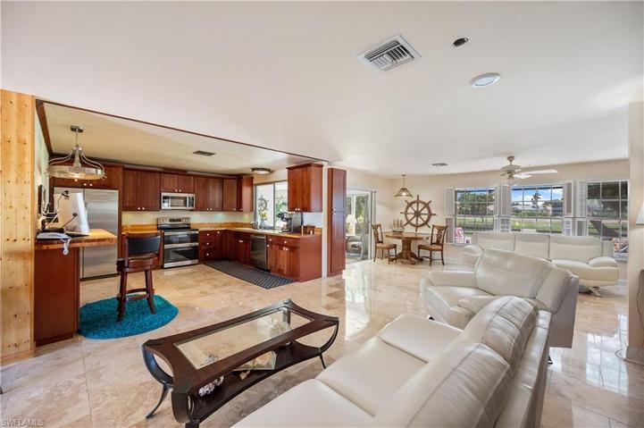 Living room leading into the Kitchen and Sitting area.