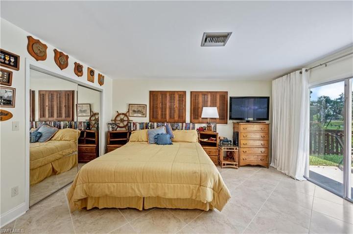 Master Bedroom with sliding glass doors out to the backyard area.