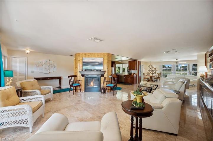 Living Room with electric fireplace that is an additional source of heat and relaxation for added comfort.