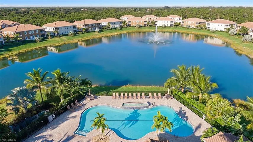 Aerial view of community pool and lake view
