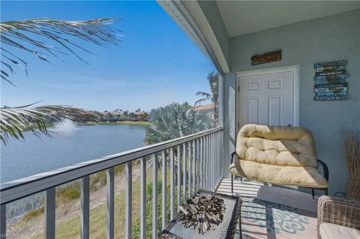 Screened lanai with lake views and outside storage closet