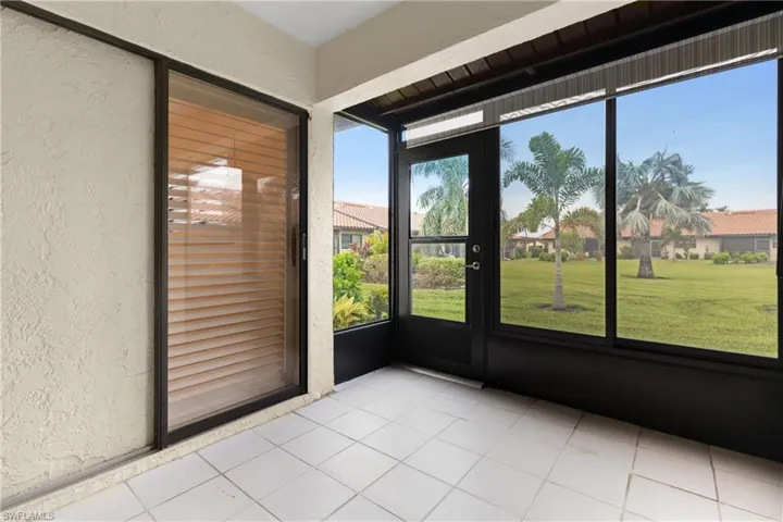 Sun Room& Laundry area inside folding louvered doors.