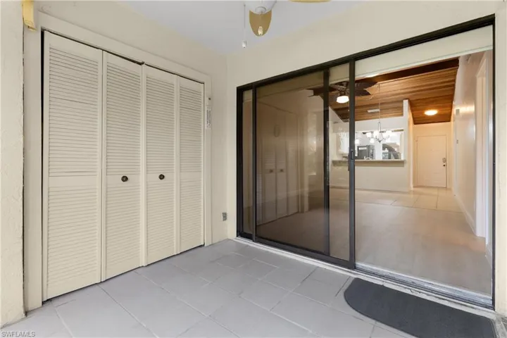 Sun Room& Laundry area inside folding louvered doors.