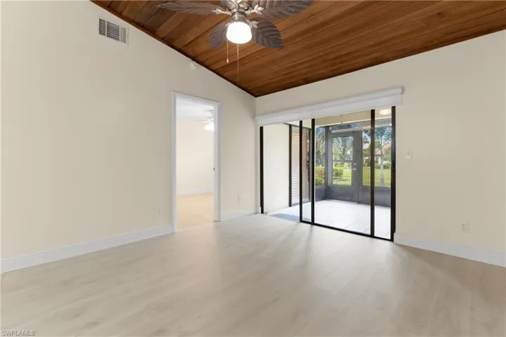 Sliding glass doors lead to enclosed rear patio.