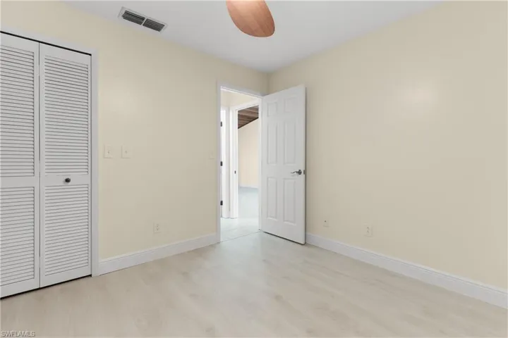 Second Bedroom has designer lighting & fan.