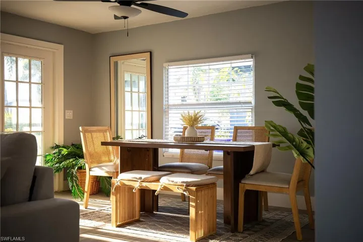 Dining room featuring a ceiling fan and baseboards