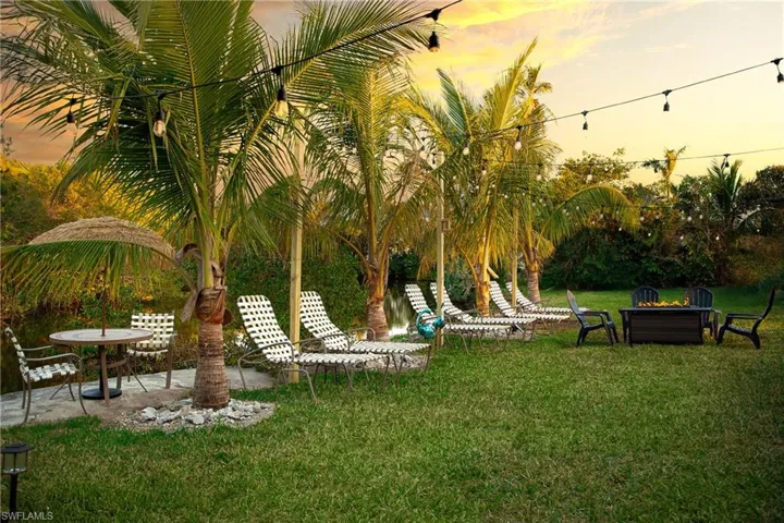 Yard at dusk with a patio and a yard