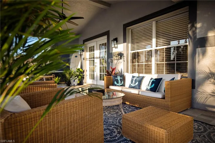 View of patio / terrace with french doors, outdoor seating, and ceiling fan